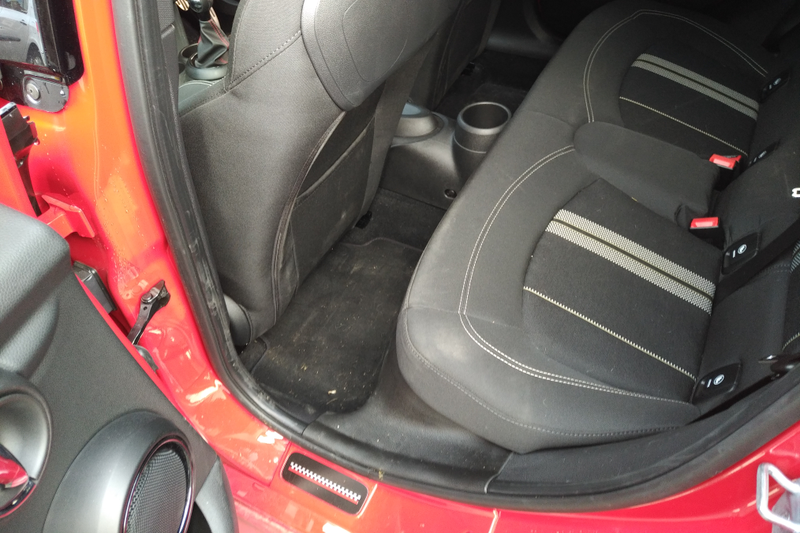 Dirty shoe scuffs on the rear of the front seats